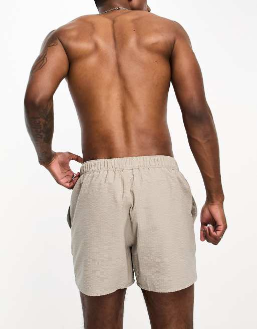 ASOS DESIGN seersucker swim shorts in short length in beige, 5 of 5