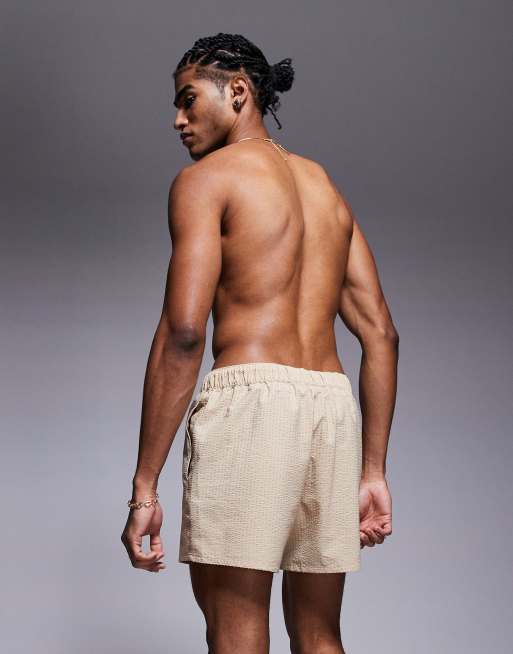 ASOS DESIGN seersucker swim shorts in short length in beige
