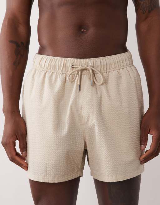 ASOS DESIGN seersucker swim shorts in short length in beige, 4 of 5