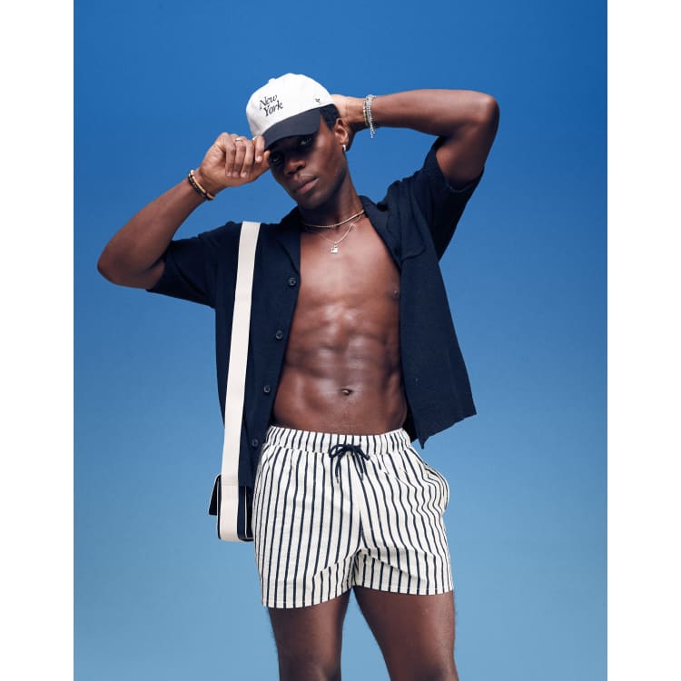 ASOS DESIGN seersucker swim shorts in short length in black and