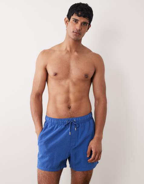 ASOS DESIGN seersucker swim shorts in short length in blue - view 1
