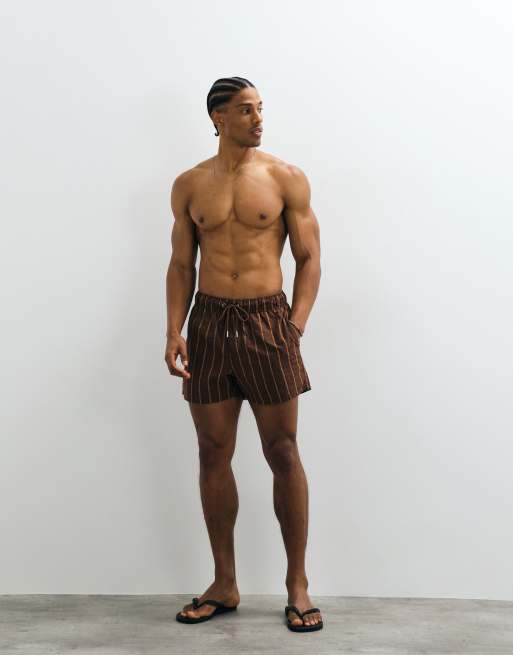 ASOS DESIGN seersucker swim shorts in short length in brown stripe, 2 of 5