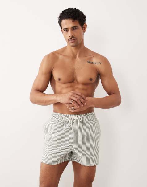 ASOS DESIGN seersucker swim shorts in short length in green stripe - view 1