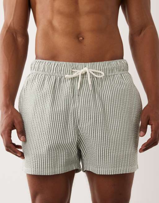 ASOS DESIGN seersucker swim shorts in short length in green stripe, 2 of 5