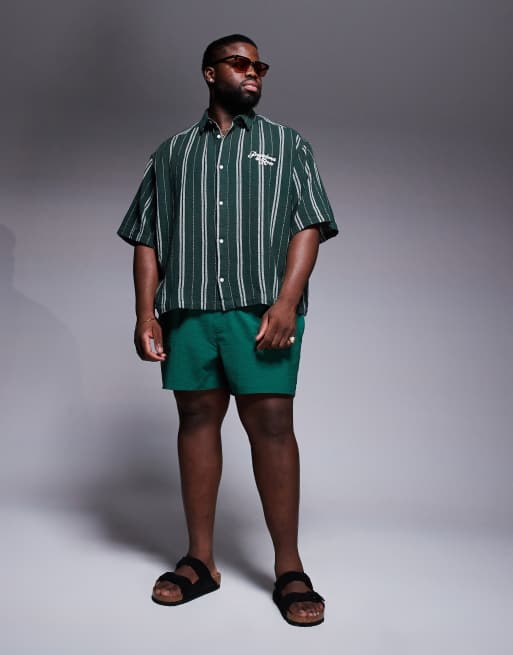 ASOS DESIGN seersucker swim shorts in short length in green