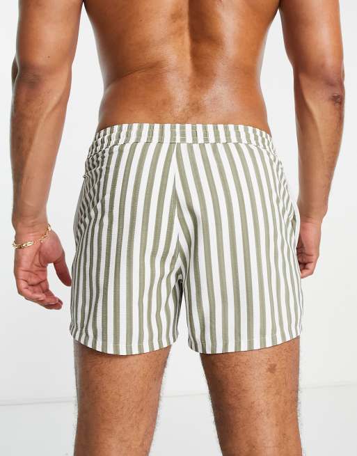 ASOS DESIGN swim shorts in short length with toggle waistband in light khaki