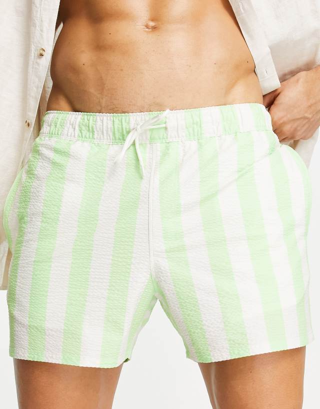 ASOS DESIGN seersucker swim shorts in short length in light green stripe