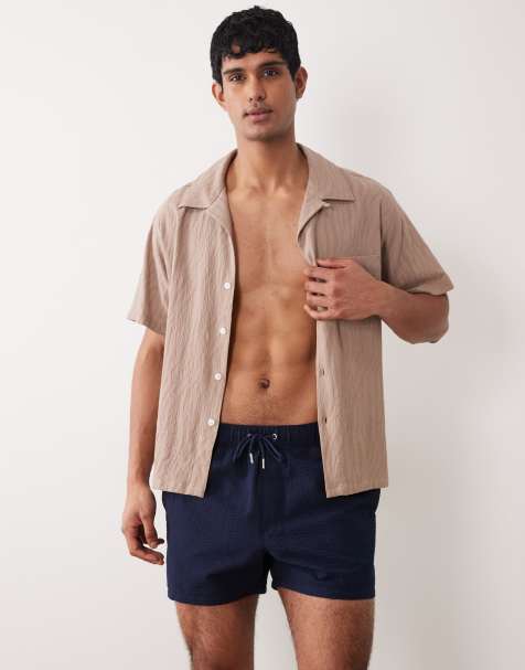 ASOS DESIGN seersucker swim shorts in short length in navy - view 1