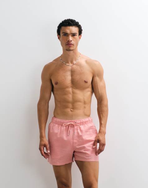 ASOS DESIGN seersucker swim shorts in short length in pink - view 1
