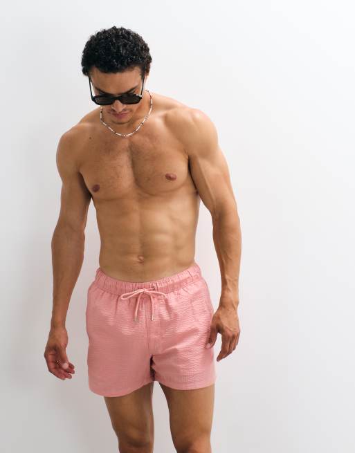 ASOS DESIGN seersucker swim shorts in short length in pink, 4 of 7