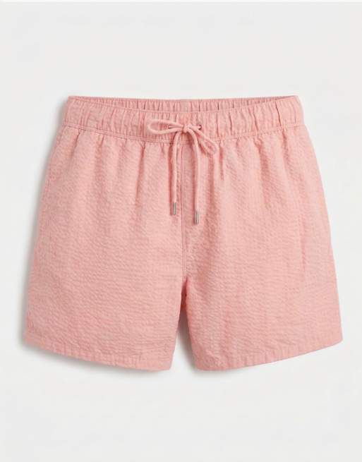 ASOS DESIGN seersucker swim shorts in short length in pink, 6 of 7
