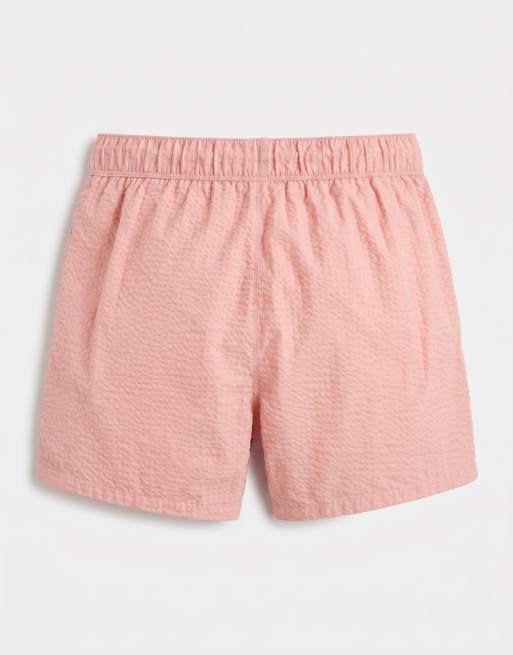 ASOS DESIGN seersucker swim shorts in short length in pink, 7 of 7