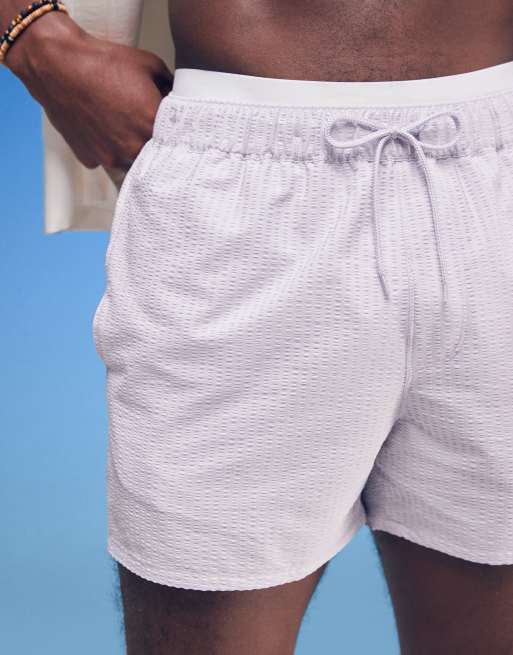 ASOS DESIGN seersucker swim shorts in short length in purple 