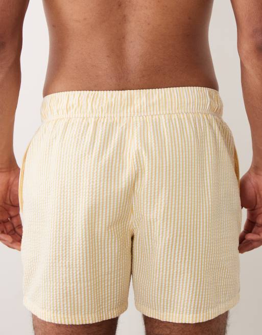 ASOS DESIGN seersucker swim shorts in short length in yellow stripe, 5 of 5