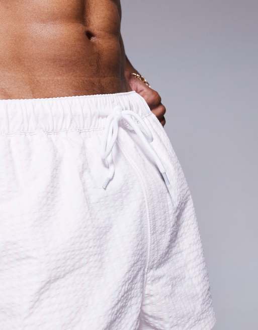 ASOS DESIGN seersucker swim shorts in super short length in pink, 2 of 4