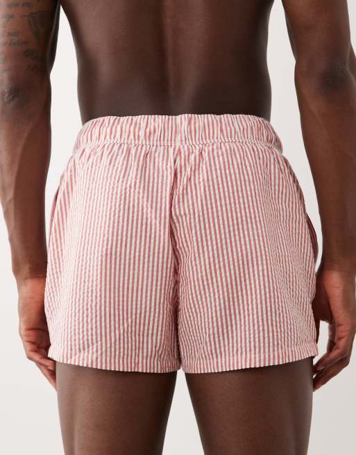 ASOS DESIGN seersucker swim shorts in super short length in red stripe, 5 of 5