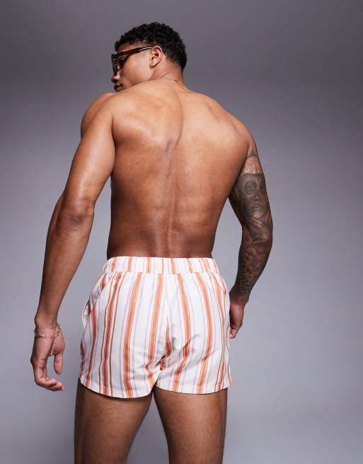 ASOS DESIGN – Sehr kurze Badeshorts in Weiß und Orange mit Streifen, 3 von 4