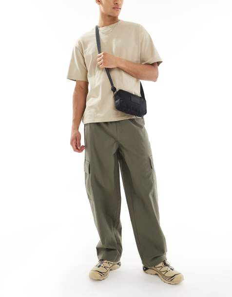 ASOS DESIGN – Sehr weite Cargohose in verwaschenem Grün mit elastischem Bund - view 1