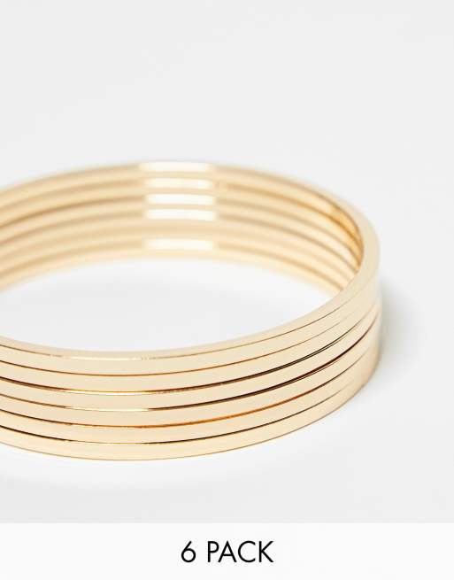 ASOS DESIGN - Set da 6 bracciali rigidi sottili color oro
