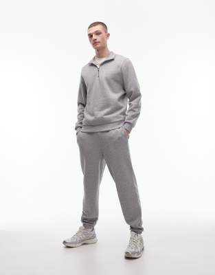 ASOS DESIGN – Set in Grau meliert mit Sweatshirt mit kurzem Reißverschluss und schmal zulaufender Jogginghose - view 1