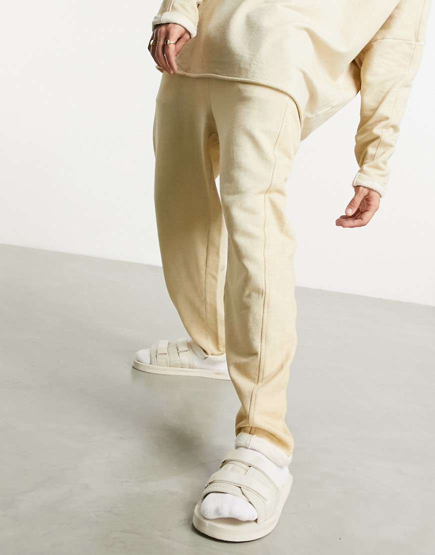 ASOS DESIGN set oversized sweatpants in beige oil wash with seam detail-Neutral