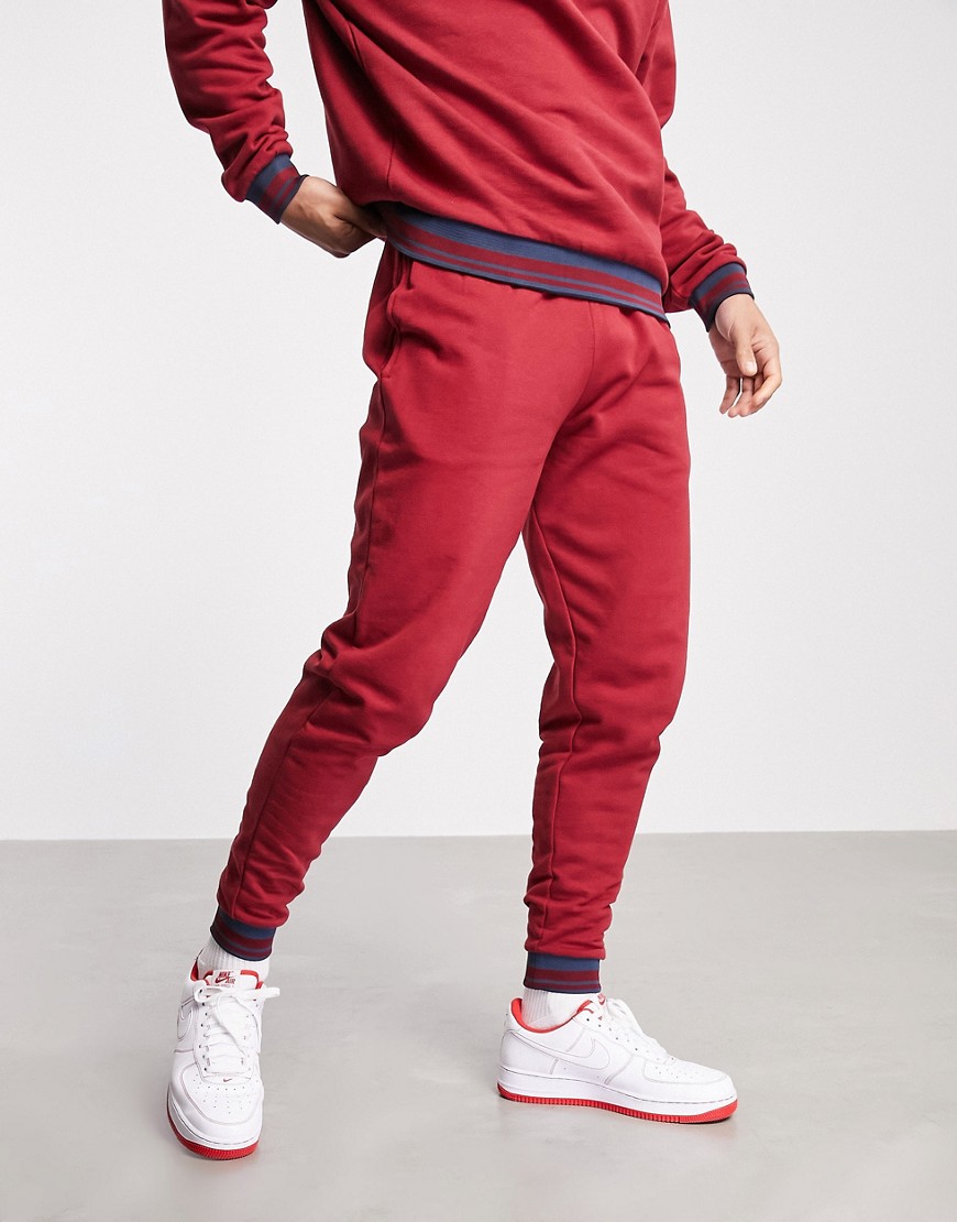 ASOS DESIGN set tapered sweatpants with tipping in red