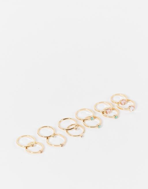 ASOS DESIGN - Set van 12 goudkleurige ringen met pastelkleurige kristallen