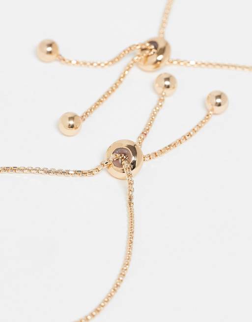 ASOS DESIGN - Set van 2 armbanden met zon- en maanhangers in goud, 3 van 3