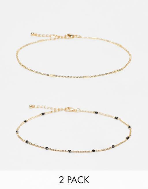 ASOS DESIGN - Set van 2 enkelbandjes met ketting en zwarte kralendetails in goudkleur