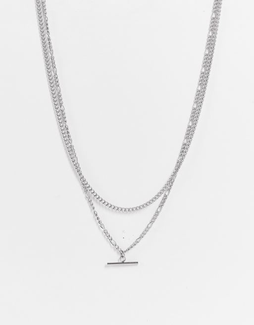 ASOS DESIGN - Set van 2 gelaagde kettingen van waterbestendig roestvrijstaal met figaroschakels en T-staafje in zilverkleur 