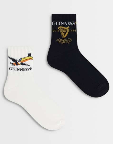 ASOS DESIGN - Set van 2 paar sokken met grafische Guinness-print in multi - view 1