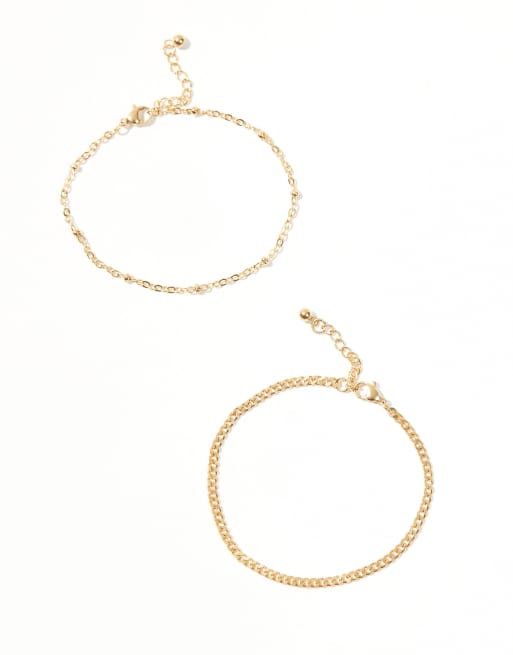 ASOS DESIGN - Set van 2 schakelarmbanden van waterbestendig roestvrij staal in goud  , 2 van 3