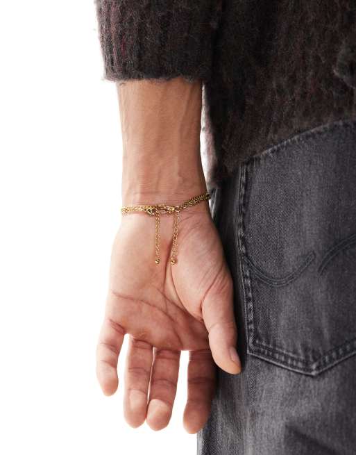 ASOS DESIGN - Set van 2 schakelarmbanden van waterbestendig roestvrij staal in goud  , 3 van 3