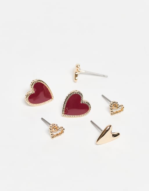 ASOS DESIGN - Set van 3 oorknopjes met hartjes in goud en bordeauxrood emaille, 2 van 3