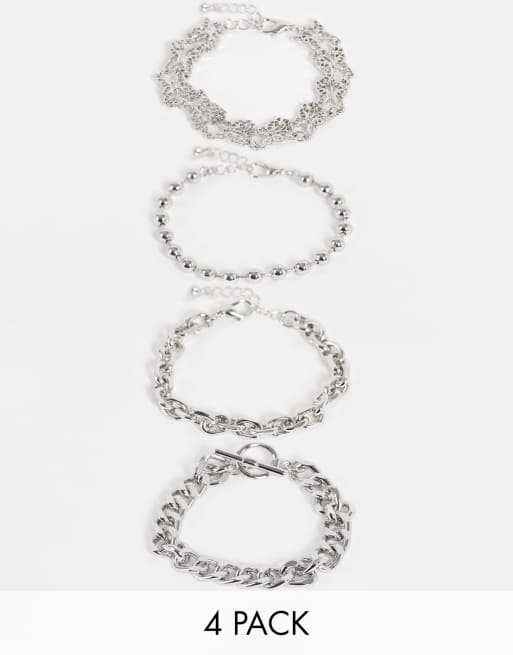 ASOS DESIGN - Set van 4 armbanden met vlinderhangertjes in zilverkleur