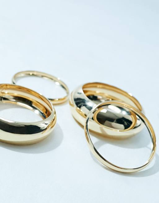 ASOS DESIGN - Set van 4 armbanden zonder sluiting met verschillende ontwerpen in goudkleur, 2 van 4
