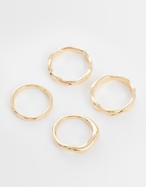 ASOS DESIGN - Set van 4 golvende ringen in goud - view 1