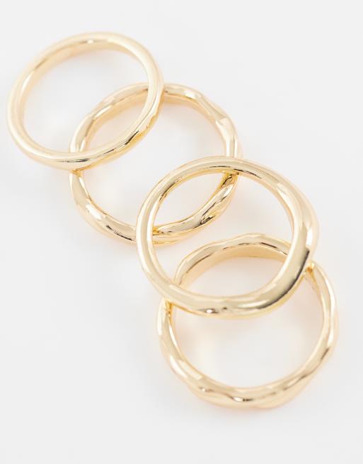 ASOS DESIGN - Set van 4 golvende ringen in goud, 2 van 3