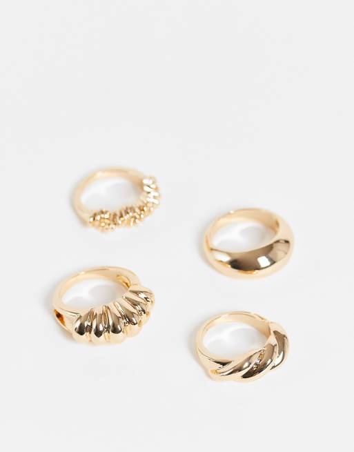 ASOS DESIGN - Set van 4 ringen met gedraaid design in goudkleur