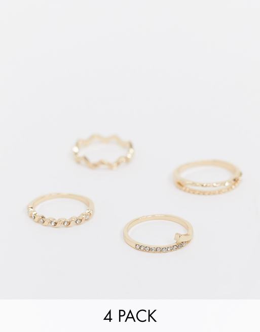ASOS DESIGN - Set van 4 ringen met gegraveerde ontwerpen in goudkleur