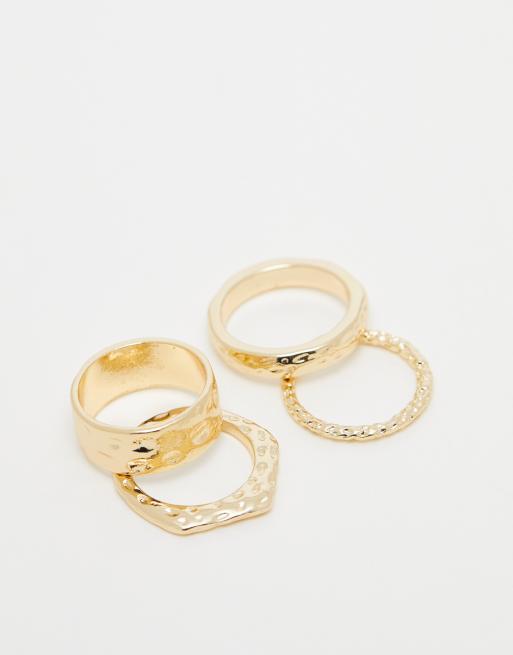 ASOS DESIGN - Set van 4 ringen met gehamerd ontwerp in goudkleur