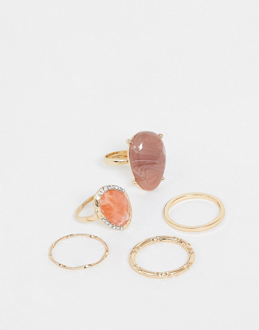 ASOS DESIGN - Set van 5 ringen met roze stenen en kristallen in goudkleur