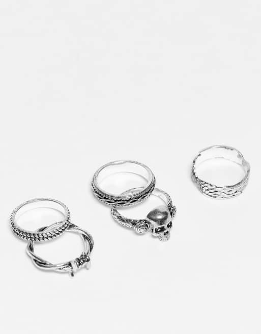 ASOS DESIGN - Set van 5 ringen met vleugels, prikkeldraad en schedel in gepolijste zilverkleur