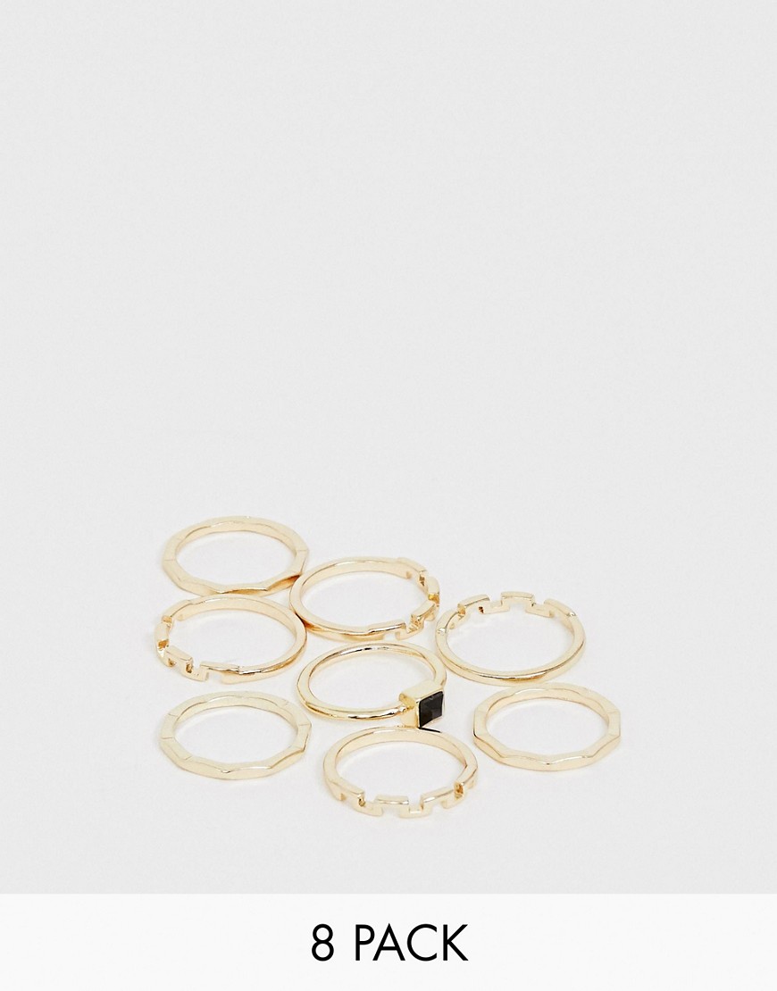 ASOS DESIGN - Set van 8 ringen met gehamerd ontwerp, zigzagontwerp en zwarte steen in goudkleur