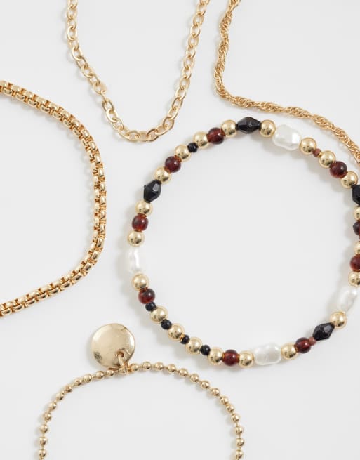 ASOS DESIGN - Set van gemengde kralenarmbanden in bordeauxrood en goudkleur, 2 van 3