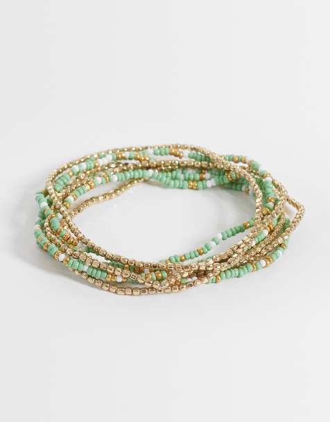 ASOS DESIGN - Set van gestapelde armbanden met gemengde groene en goudkleurige kralen - view 1