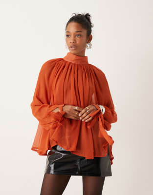 sheer high neck blouse with tie cuff detail in rust-Red