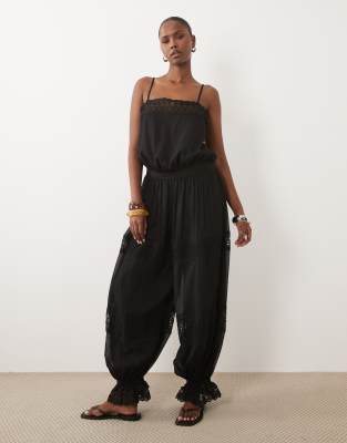 Asos Design Sheer Lace Jumpsuit With Bubble Hem In Black