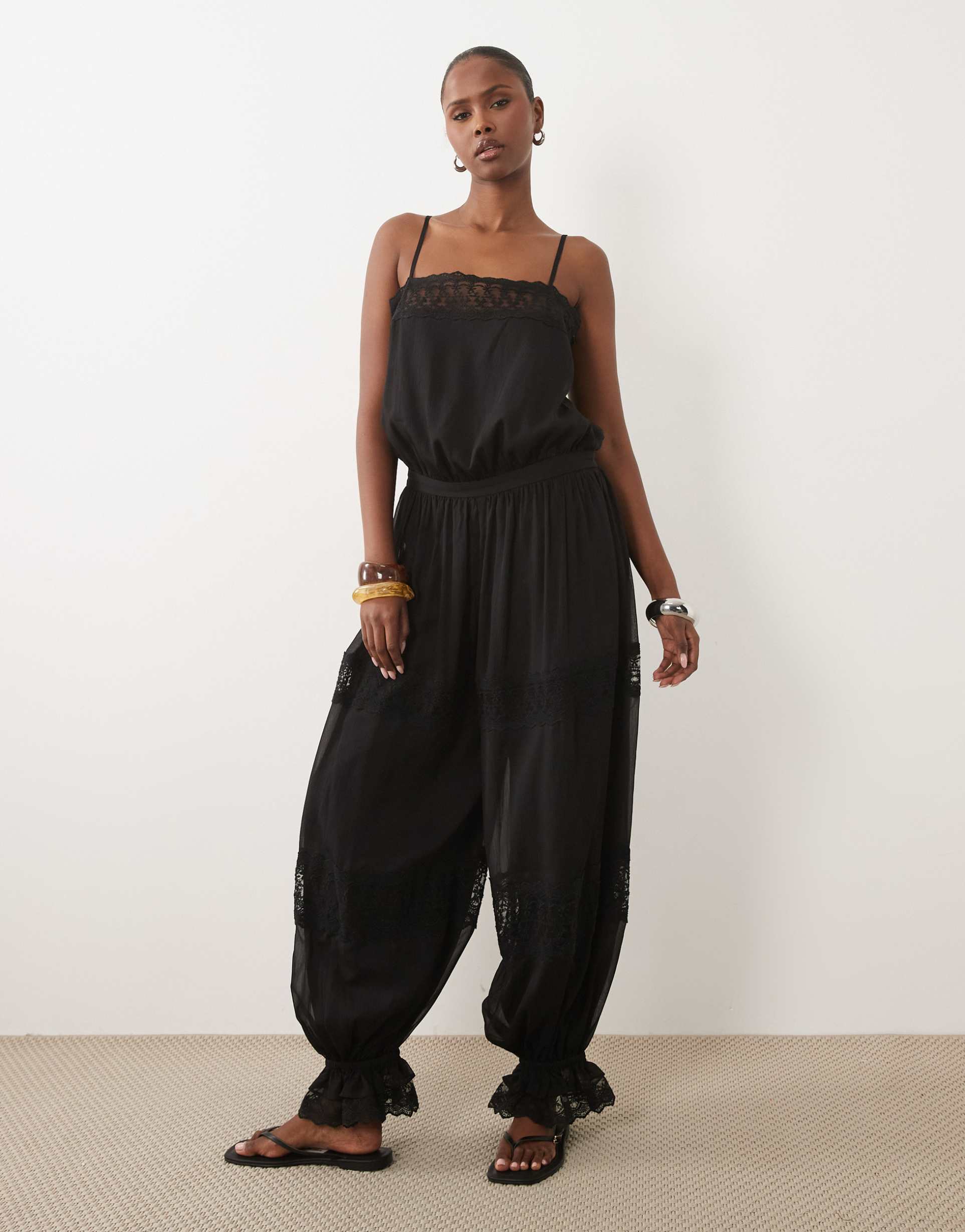 asos design sheer lace jumpsuit with bubble hem in black