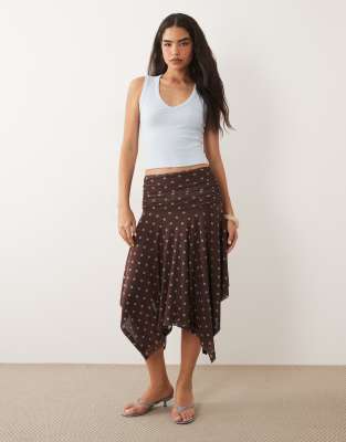 ASOS DESIGN sheer mesh hanky hem skirt in brown polka dot print